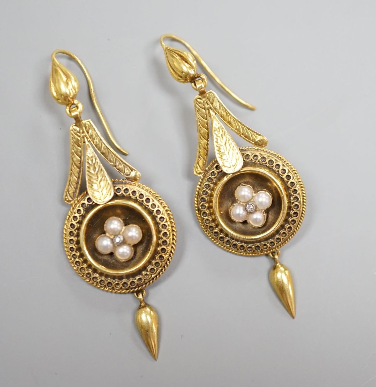 A pair of antique yellow metal, split pearl and diamond chip set drop earrings, overall 54mm, gross weight 5.9 grams.